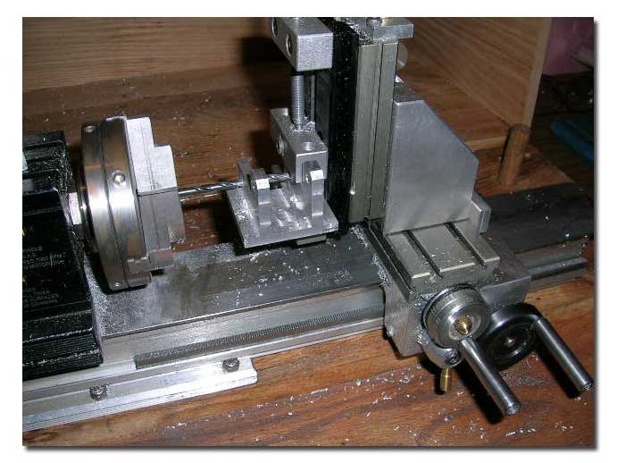 Drilling bracket for bolts to hold barrel.